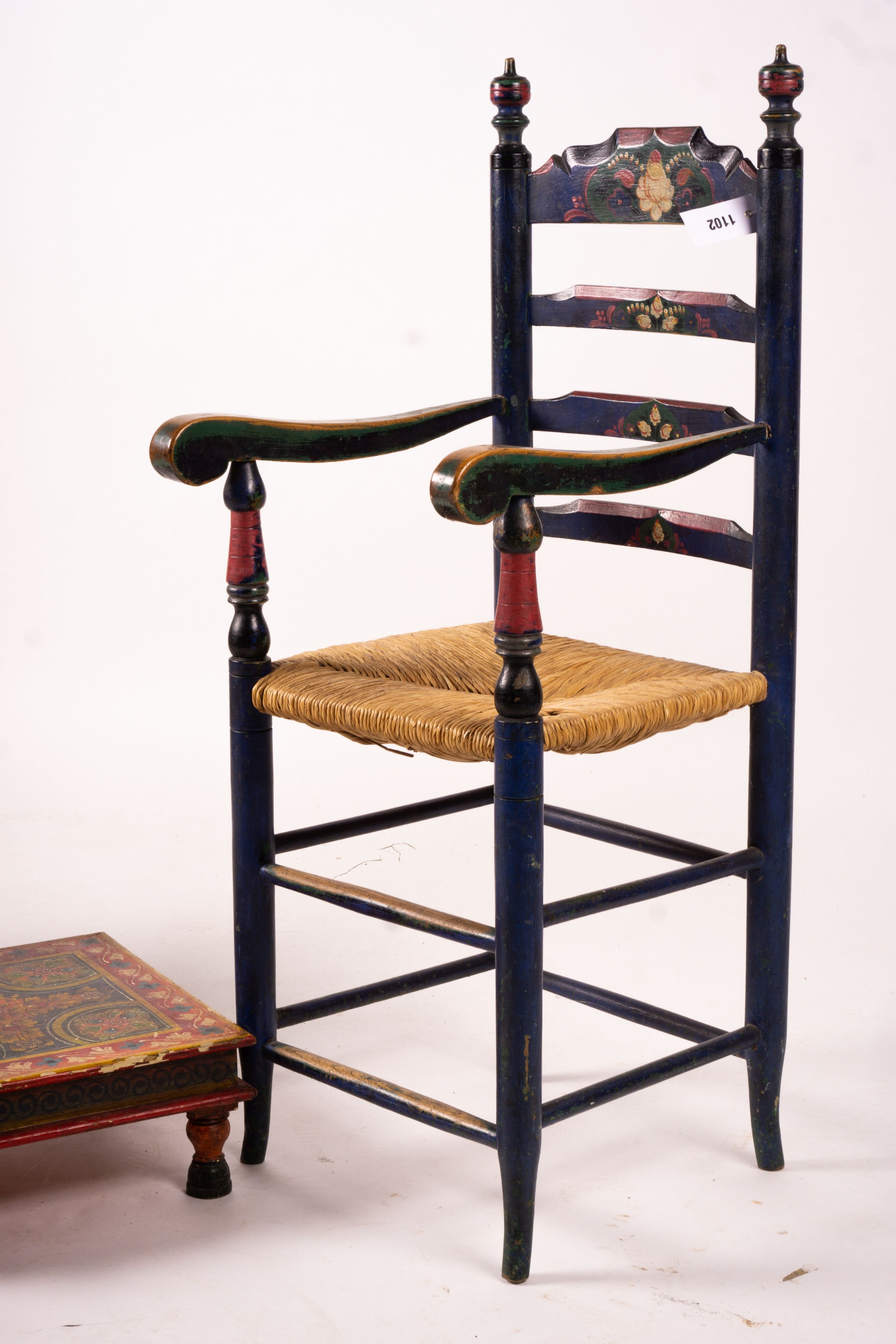 Two 19th / early 20th century Swiss painted rush seat chairs, together with a square low table